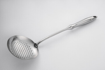 Stainless steel tableware and kitchen utensils placed on the desktop