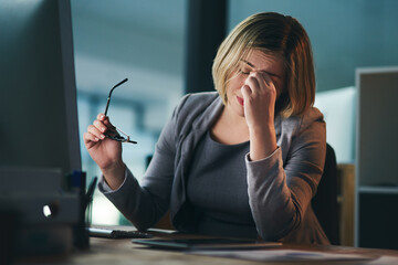 Pain, headache and business woman in office, tired or fatigue while working late at night on computer. Burnout, migraine and female person with depression, anxiety or brain fog, stress and deadline.