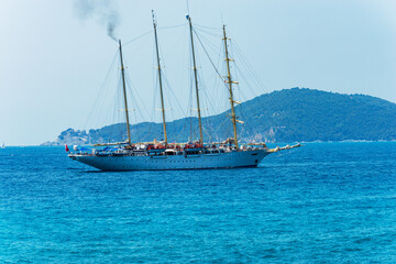 Large sailing ship with four masts in the blue Mediterranean sea in front of the Palmaria island,...