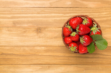 Strawberries on wooden background, top view