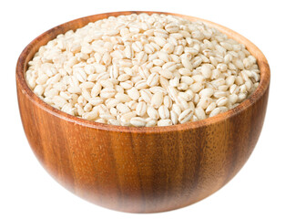 Raw highland barley in the wooden bowl, isolated on white background.