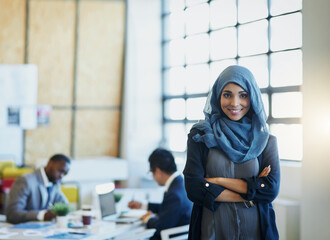 Muslim woman, business and portrait in an office with a smile and arms crossed for career pride....