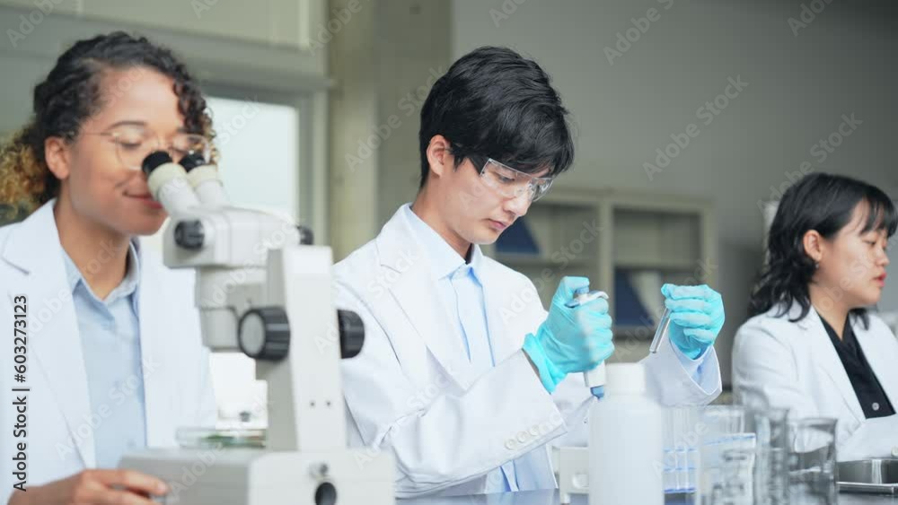 Poster multinational researcher group experimenting in the lab.