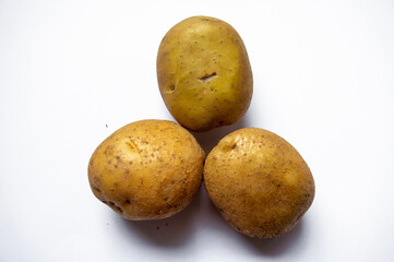 fresh potatoes just harvested on white background