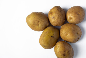 fresh potatoes just harvested on white background