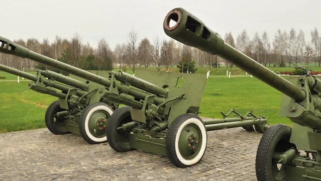 Three 76-mm ZIS-3 howitzer guns. An exhibition of World War II military equipment in a park in Belarus. The most massive Soviet cannon from the Second World War
