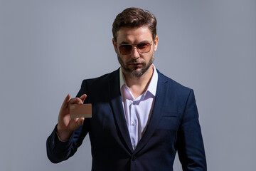 Man with a credit card to review statements. Credit cards purchases online. A man with a credit card with credit history making payments. Debit card offers. Money and budget. Personal finance.