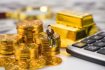 Stacks of gold money coin with calculator background, Business and financial concept.