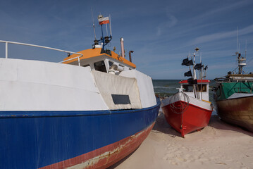 Naklejka premium FISHING BOATS - Small ships on the sea shore