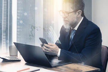 Mature Man Analyzing Financial Data on Devices - Graphic composition of a man sitting at a desk...