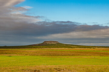Icelandic landscape with a small volcanic crater called Eldborg a blue sky and summer day, Iceland