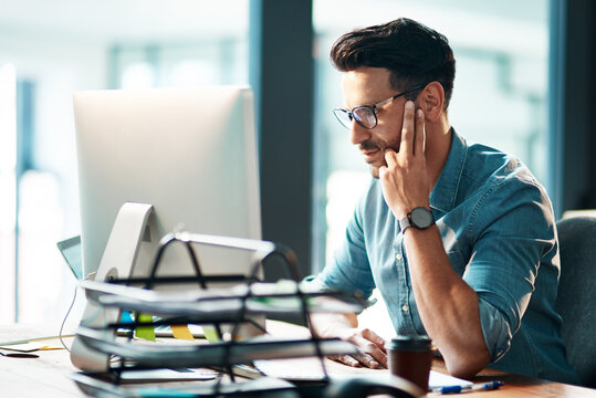 Serious, business man and computer in office for planning startup, online research and reading email report at desk. Focused worker, desktop pc and website connection for project, internet and tech