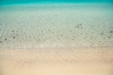 Fototapeta na wymiar Crystal clear water along the beach Capo Ceraso, Sardinia 