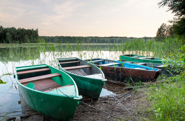 Naklejka na ściany i meble Fishing boats at the lake