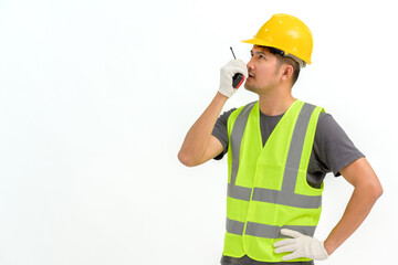 Portrait of male construction worker wearing hard hat holding construction walkie talkie isolated on white background Copy space over a white studio background.