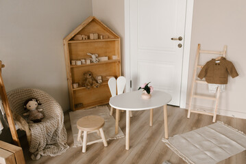 Stylish Scandinavian-style children's room interior with handmade wooden products