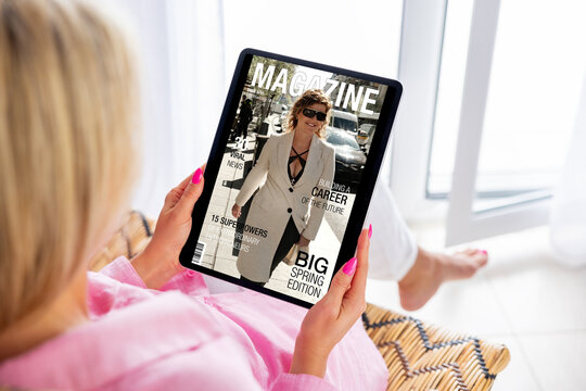 Woman reading magazine on tablet computer