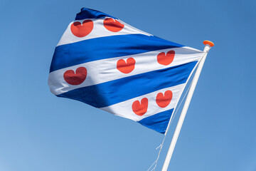 flag of Dutch province Friesland flying in the wind