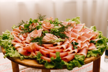 Table with rustic meat delicacies and pickles
