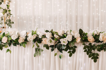 Wedding decor, decoration of the newlyweds' table with flowers