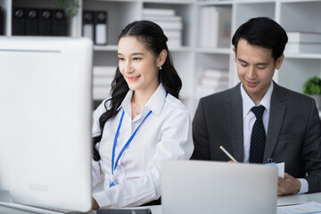 Businessmen team or financial data analysts working with tablets and laptop computers and data graphs together. Plan to analyzing projects in the office.