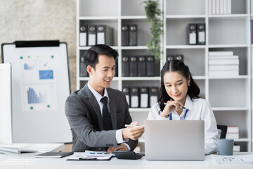 Businessmen team or financial data analysts working with tablets and laptop computers and data graphs together. Plan to analyzing projects in the office.