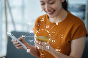 Hands holding credit card and using smartphone in home. Online shopping.