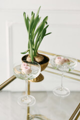 Peony rose buds in a glass, floral cocktail