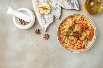 plate of pilaf. traditional Uzbek dish. rice with vegetables. banner, menu, recipe place for text, top view