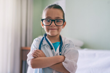 Girl child, portrait and playing doctor with smile, glasses and stethoscope in home, hospital or...