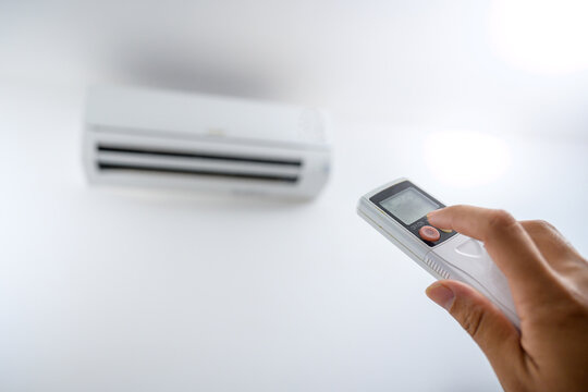 Air conditioner remote control, adjust the temperature to 25 degrees Celsius with a remote control in the room at home.
