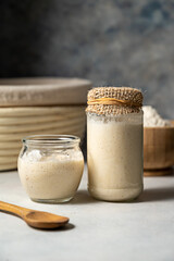 Sourdough starter in jars. Healthy wild fresh homemade yeast for sourdough bread baking.