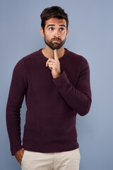 Thinking, wonder and man in studio with unsure, uncertain and thoughtful on gray background in studio. Doubt mindset, mockup space and face of male person thoughtful for decision, choice and question