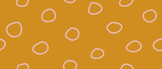 Cute Hand Drawn Abstract Polka Dots Vector Pattern. Pastel Pink Circles on a Golden Orange Background. Simple Irregular Dotted Vector Print ideal for Wrapping Paper. Pink Dots on a Mustard Yellow.