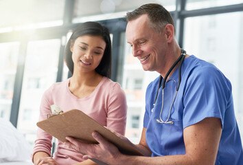 Medical, consulting and doctor with patient and checklist for advice, questions or research....
