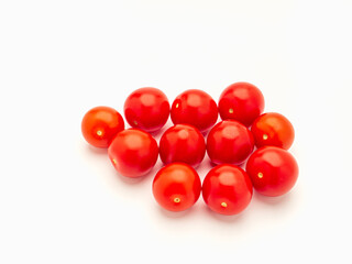 A pile of fresh tomatoes on a white background.