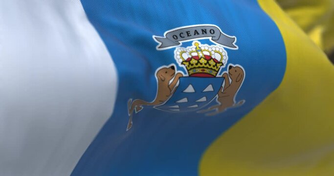 Seamless loop in slow motion of Canary Islands flag waving in the wind