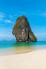 Fototapeta na wymiar vertical wide angle photo, phra nang beach in Thailand, paradise, sandy shore, sunbathing and swimming in the sea, blue ocean and sky, relaxation and enjoyment