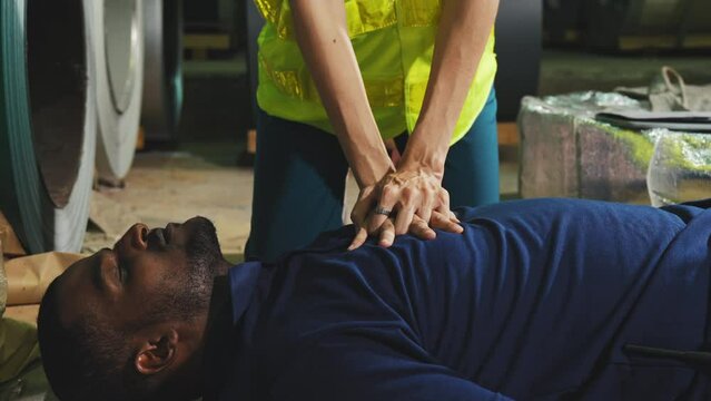 Emergency on worker in factory, First aid emergency CPR on heart attack Man , One part of the process resuscitation - Healthcare concept.