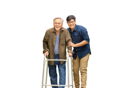 Senior Asian Father And Middle Aged Son, Caregiver Is Teaching Old Man To Walk With Walker, Elderly Senior Man With Son On Isolate Background