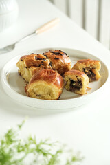 pisang bolen is made from bananas covered in rolled sheet of pastry dough filled chocolate and cheese
