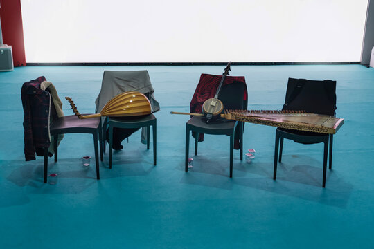 The orchestra took a break and the instruments were left on the seats.