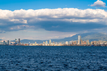 Naklejka premium Izmir, Turkey - April 28 2023: View on Izmir downtown from Izmir's bay