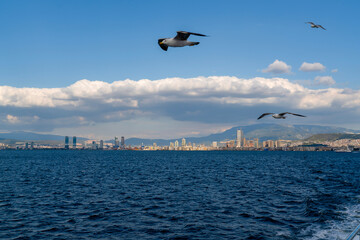 Fototapeta na wymiar Izmir, Turkey - April 28 2023: View on Izmir downtown from Izmir's bay