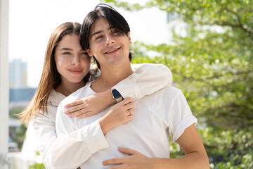 Romantic young couple in love happy romance relationship together. Portrait of handsome man and his beautiful girlfriend tenderly embracing affection. Lover enjoying valentine, honeymoon or dating.