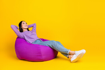 Full body photo of young chinese girl wear purple shirt denim jeans take nap rest hands head bean...