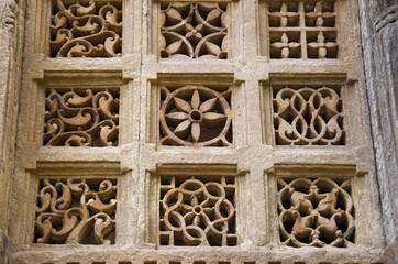 Stone carvings on outer wall of Jami Masjid (Mosque), UNESCO protected Champaner - Pavagadh...