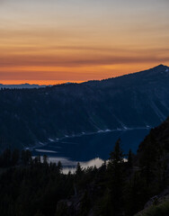 Afterglow of Sunset Reflects in Clouds Over Crater Lake