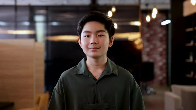 Headshot Teenager Boy Portrait Self-confident Walking Smile Standing Looking At Camera, Young Student Using Co-working Space, Library To Do Homework Or Digital Work From Roaming Everywhere Lifestyle