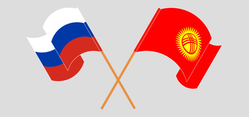 Crossed and waving flags of Russia and Kyrgyzstan